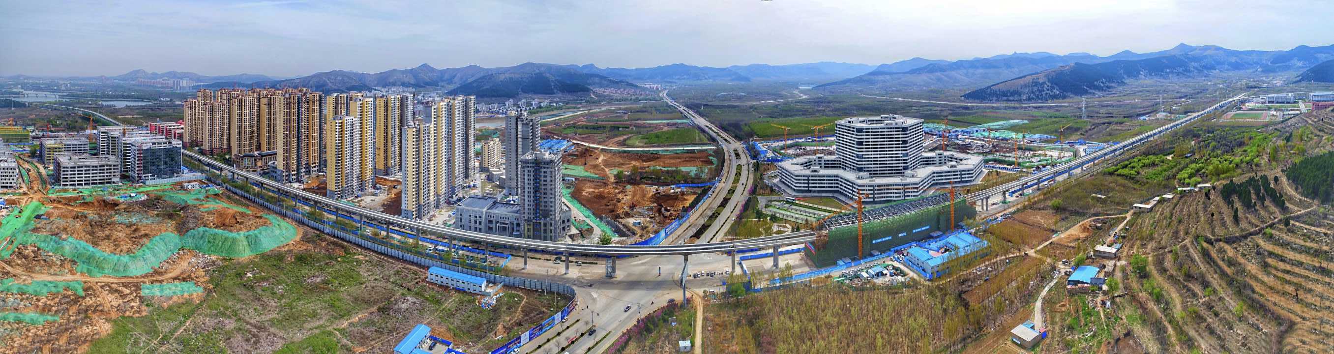 穿越春天的高空“地铁” 济南地铁R1线在春天的画卷中穿行