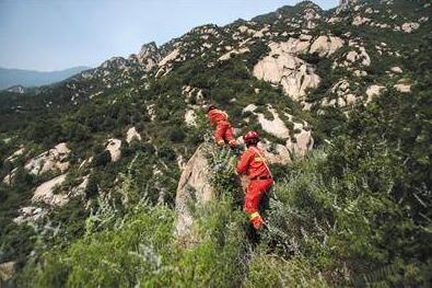 女子在北京凤凰岭失联 百人搜救七天仍未找到踪迹