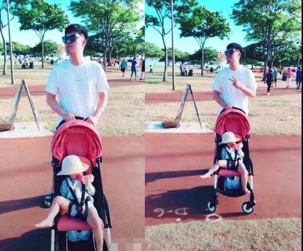 陈赫与女儿海边看鸽子 安安单手拿奶瓶坐姿霸气