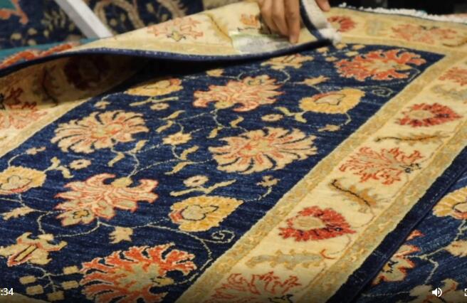 GLOBALink | Afghan families see certainty in Chinese market through CIIE: carpet merchant