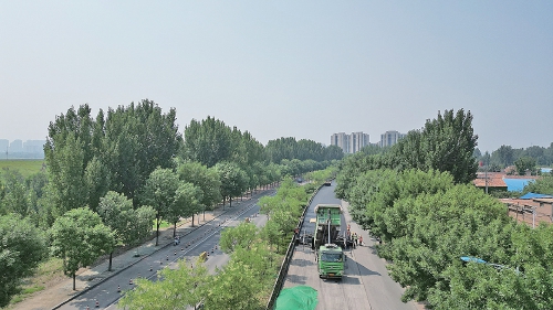 顶着酷暑“练三伏”绿色低碳靠科技 济南“养护第一团”鏖战国省道施工一线